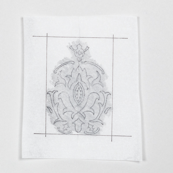 Using your pencil shade the entire back side of your tracing paper